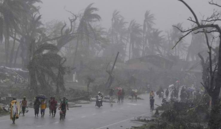 "Survivors walk on a road amidst heavy downpour after Typhoon Haiyan battered Tacloban city in central Philippines. One of the most powerful storms ever recorded has killed at least 10,000 people in the central Philippines province of Leyte, with coastal towns and the regional capital devastated by huge waves. Typhoon Haiyan destroyed about 70 to 80 percent of the area in its path as it tore through the province, according to local authorities." Reuters